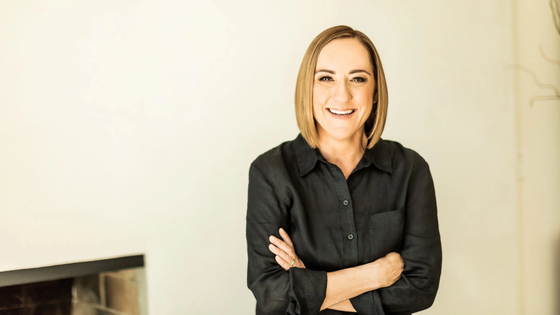 Christine Caine in a black shirt against a light background